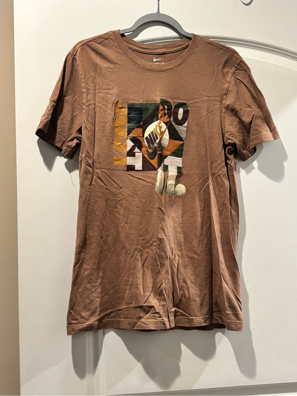 Nike Brown Graphic Tee with Multicolor Geometric Print